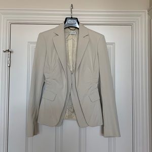 Altuzarra beige jacket of polyamide and elastane with inner vest hook closure.
